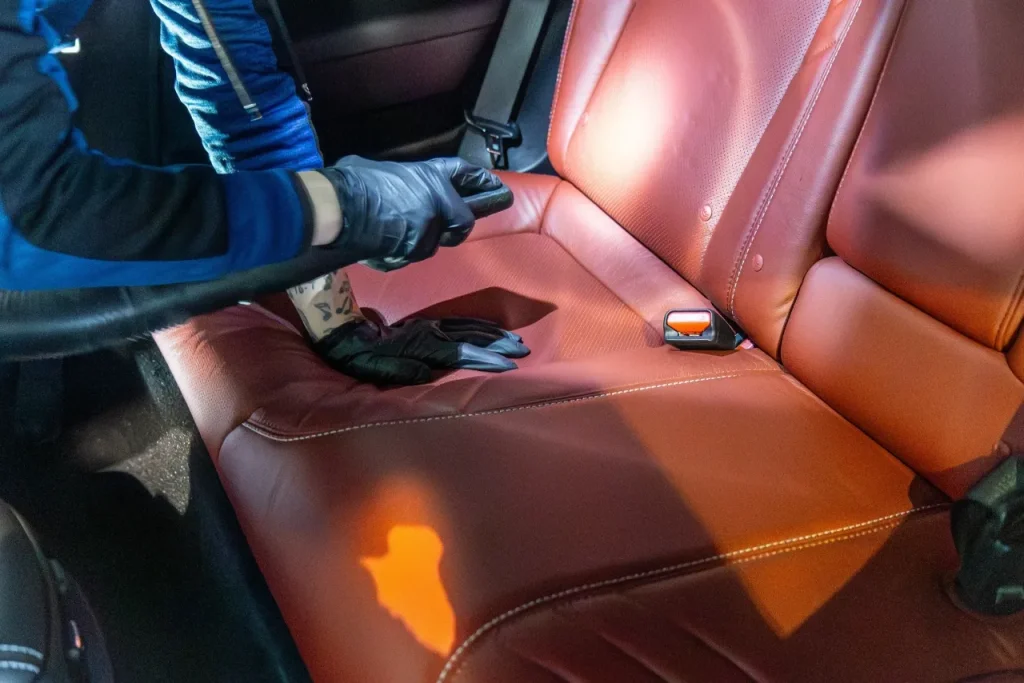 Interior auto detailing of a leather car seat